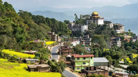 Una-Vista-De-Lapso-De-Tiempo-Del-Monasterio-Neydo-Tashi-Choling-En-La-Pequeña-Ciudad-De-Dakshinkali-En-Nepal-Rodeada-De-Campos-De-Mostaza