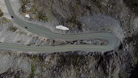 Two-Cars-Drive-On-a-Mountain-Highway