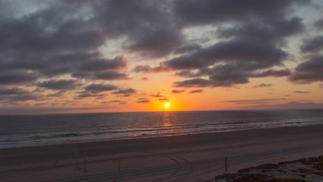 Timelapse-of-beautiful-beach-at-the-time-of-sunset-and-cloud-passing-over-head