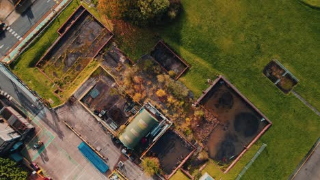 Futuristic-looking-aerial-drone-footage,-with-a-sci-fi-steampunk-look-with-industrial-buildings-and-vehicles