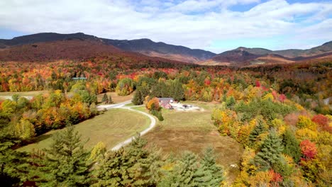 aerial-push-toward-stowe-vermont-through-fall-leaf-color
