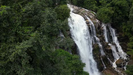 Drone-reveal-of-beautiful-lush-green-Jungle-Waterfall