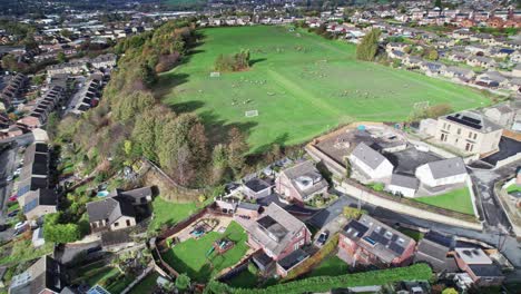 Aerial-drone-video-footage-of-extensive-playing-fields-situated-on-the-top-of-a-hill