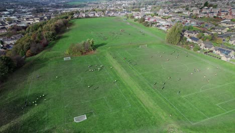 Aerial-drone-video-footage-of-English-playing-fields-situated-on-the-summit-of-a-hill