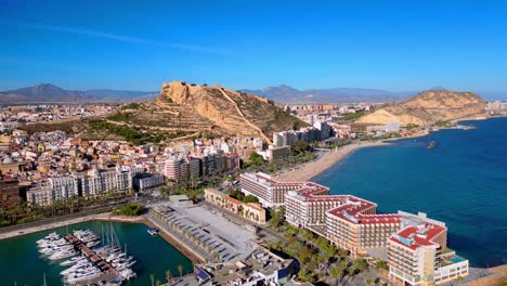 4k-drone-flight-over-Alicante,-marina,-beach,-hotels-and-castillo-de-santa-barbara