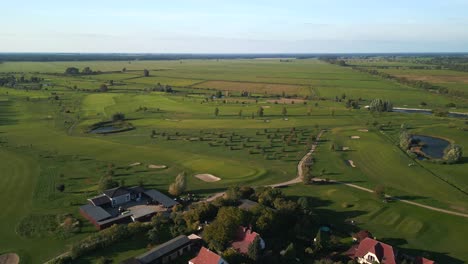 Unbelievable-aerial-view-flight-drop-down-drone-of-golf-course-fairway-green-in-the-forest