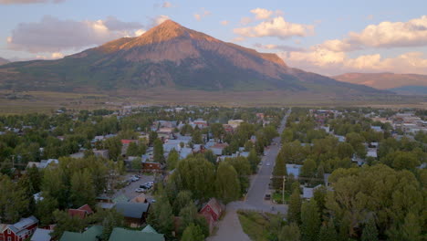 Aerial-landscape-of-Crested-Butte-with-the-mountain-on-the-horizon-on-a-beautiful-summer-evening