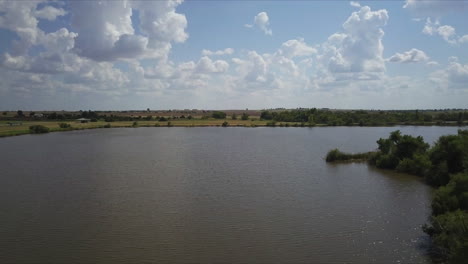 Establishing-drone-shot-of-an-open-lake-in-the-countryside