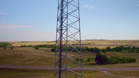 Drone-view-of-a-cellular-tower-with-meadows-in-the-background