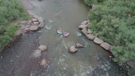 Aerial-view-of-people-going-down-a-glacier-river-in-tubes-in-Colorado-Springs
