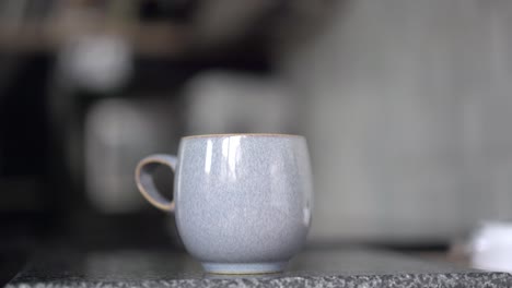 Man-making-a-hot-mug-of-tea-on-counter