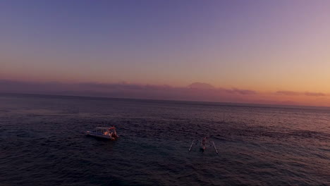 Drone-shot-flyover-boats-at-sunrise-in-bali