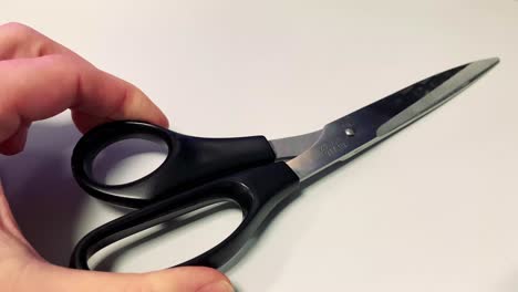 Place-a-pair-of-scissors-on-a-table