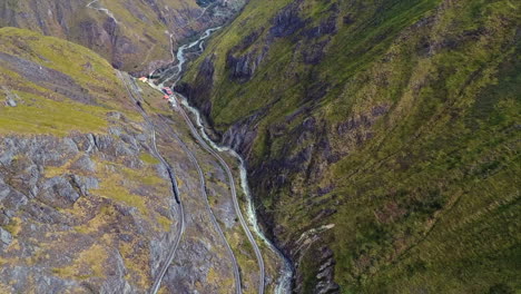 An-aerial-shot-of-a-train-going-around-the-"Nariz-del-Diablo"-or-Devil's-Nose-in-Alausí,-Chimborazo-Province,-Ecuador