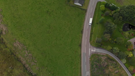 Aerial-shot-of-light-traffic-along-a-rural-UK-country-road