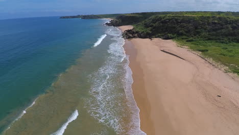 An-aerial-shot-of-Playa-Rosada,-a-tropical-pink-sand-beach-near-Ayangue-on-the-Ruta-del-Spondylus-on-the-coast-of-Ecuador
