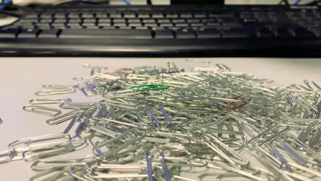 Putting-paper-clips-on-a-desk
