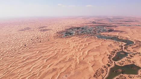 Aerial-shot-of-the-manmade-lakes-of-Al-Qudra-Dubai-UAE-Desert-Oasis