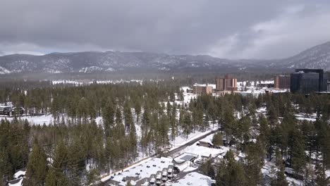Aerial-panning-shot-of-Lake-Tahoe-Nevada-California-USA-during-the-snowy-season