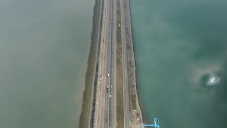 a-breakwater-road-that-separates-the-sea
