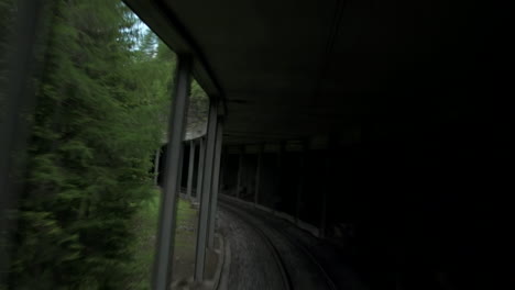 Train-moving-slow-through-tunnel-with-column