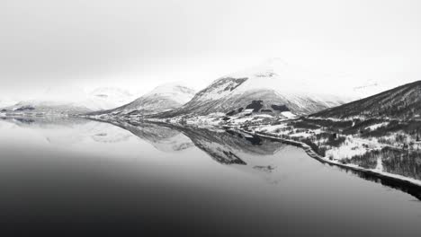 Drone-shot-of-mountains-in-Tromso,-Norway-during-winter