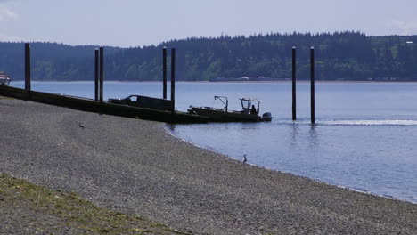 Small,-nondescript-fishing-loading-onto-trailer-from-public-boat-launch-ramp-at-Camano-Island-State-Park,-WA-State-20sec-24fps-slow-motion