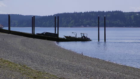 Small,-nondescript-fishing-loading-onto-trailer-from-public-boat-launch-ramp-at-Camano-Island-State-Park,-WA-State-40sec-24fps-slow-motion