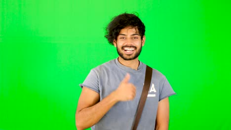 indian-tourist-point-out-good-place-with-green-screen-with-green-background