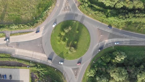 An-aerial-view-of-a-roundabout-in-England-flying-upwards