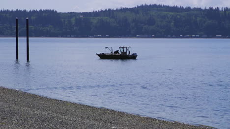 Small,-nondescript-fishing-floating-near-dock-at-Camano-Island-State-Park,-WA-State-10sec-60fps-Version-3