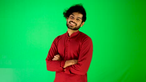 Indian-guy-say-hello-to-camera-with-green-screen