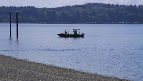 Small,-nondescript-fishing-floating-near-dock-at-Camano-Island-State-Park,-WA-State