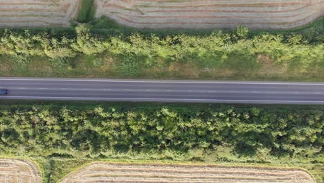 An-aerial-view-of-a-country-road-in-sunny-England