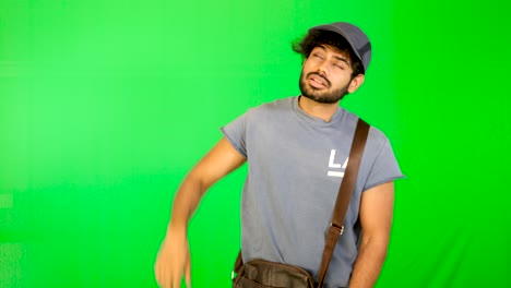 Indian-guy-feel-exhausted-with-green-screen-green-table