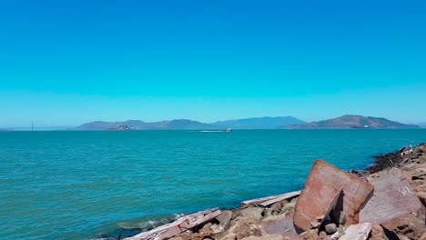 Panorama-shot-from-coast-of-Treasure-Island-showing-Alcatraz-Island,-Golden-Gate-Bridge,-San-Francisco-and-the-Bay-Bridge-on-a-beautiful-summer-day-in-California,-United-States