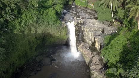 FLY-OVER-CASCADE,-Dolly-Forward-View-of-Tegenungan-Waterfall,-incredible-drone-view,-Bali,-Indonesian