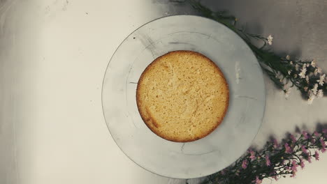 Slow-motion-placing-a-cake-on-a-white-plate-closeup