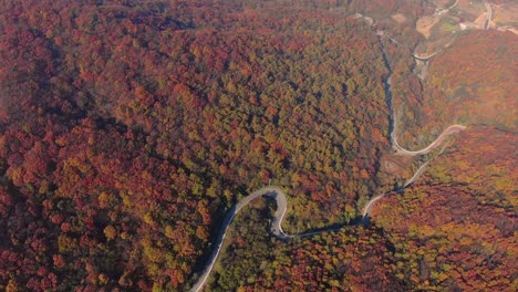 the-red-colored-winding-road-of-autumn-mountain