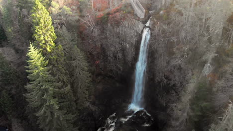 Slow-zoom-in-aerial-shot-of-Plodda-falls-in-the-Scottish-Highlands