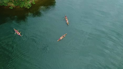 three-canoes-roaming-the-river