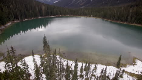 Drone-shot-flying-over-a-lake-in-the-Rocky-Mountains