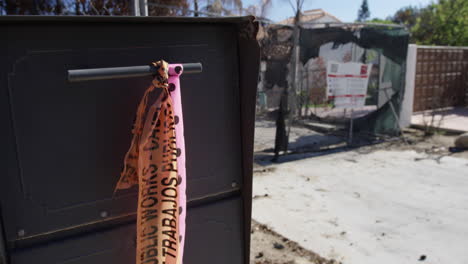Pink-Total-Loss-Ribbon-on-a-Mailbox-of-a-burned-home-in-Malibu-California