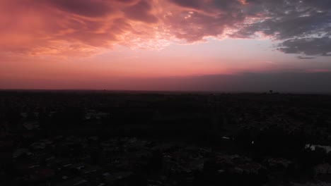 Aerial-drone-shot-of-a-colourful-orange-and-pink-sunset