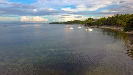 Watch-tower-over-sea-in-Philippines-on-calm-day,-drone-shot