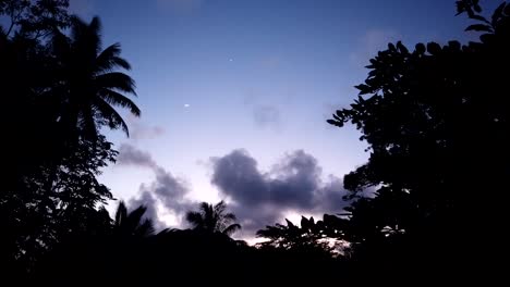 A-crescent-moon-appearing-on-a-time-lapse-as-the-sun-has-set-and-twilight-colours-show-through