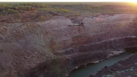 Flying-Over-an-Abandoned,-Open-Pit-Gold-Mine-in-Outback-Australia