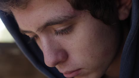 Closeup-of-a-teenage-boy-looking-sad-and-depressed
