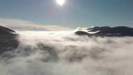 Dramatic-aerial-timelapse-of-fog-rolling-into-quiet-mountain-valley
