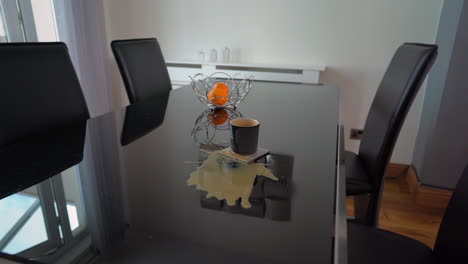 Man-spills-coffee-on-glass-table-ruined-day-at-home
